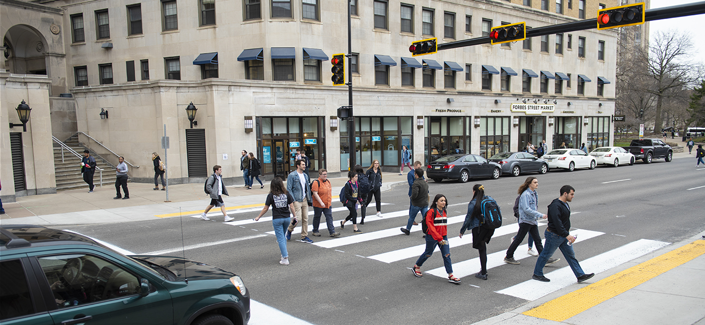 pedestrians at crosswalk on Forbes Avenue