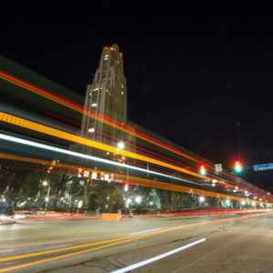 Cathedral of Learning at night with traffic lights