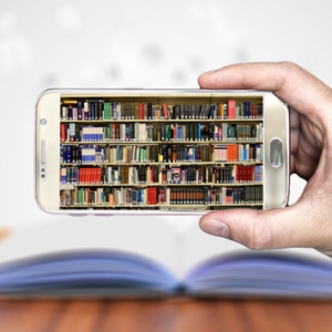 A photo of a bookshelf on a smartphone